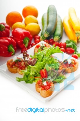 Original Italian Fresh Bruschetta Served With Fresh Salad And Ve… Stock Photo