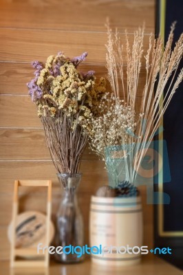 Ornamental Basket Of Wheat On Wooden Table Stock Photo