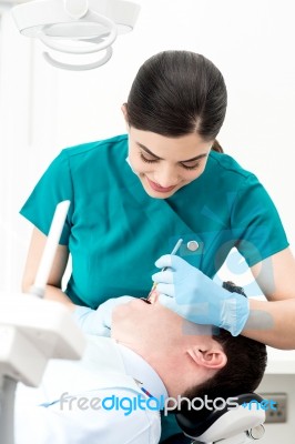 Orthodontist Examining Patient Stock Photo