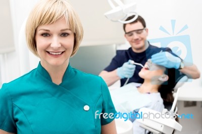 Orthodontist, Patient And Assistant In Clinic Stock Photo