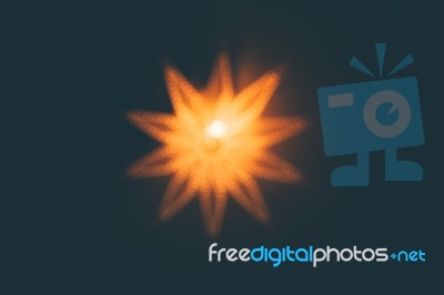 Out Of Focus Bokeh Lit Up Glowing Christmas Star Background Stock Photo