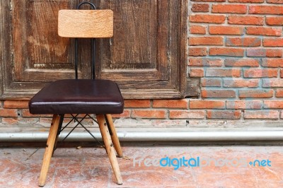 Outdoor Chair On Wood Wall Stock Photo