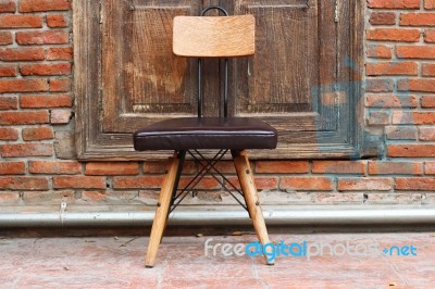 Outdoor Chair On Wood Wall Stock Photo