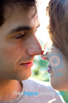 Outdoor Portrait Of Young Caucasian Couple At The Park Stock Photo