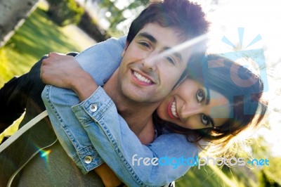 Outdoor Portrait Of Young Caucasian Couple At The Park Stock Photo