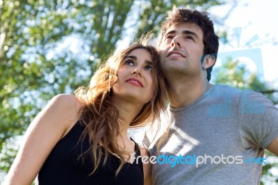 Outdoor Portrait Of Young Caucasian Couple At The Park Stock Photo