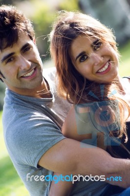 Outdoor Portrait Of Young Caucasian Couple At The Park Stock Photo