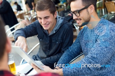 Outdoor Portrait Of Young Entrepreneurs Working At Coffee Bar Stock Photo