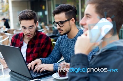 Outdoor Portrait Of Young Entrepreneurs Working At Coffee Bar Stock Photo