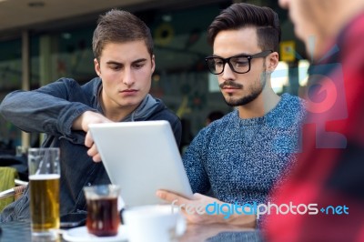 Outdoor Portrait Of Young Entrepreneurs Working At Coffee Bar Stock Photo