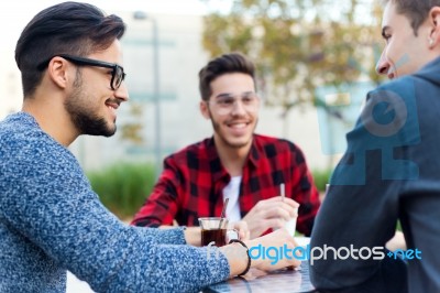 Outdoor Portrait Of Young Entrepreneurs Working At Coffee Bar Stock Photo