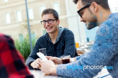 Outdoor Portrait Of Young Entrepreneurs Working At Coffee Bar Stock Photo