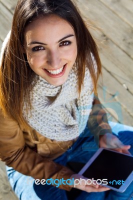 Outdoor Portrait Of Young Woman With Digital Tablet Stock Photo