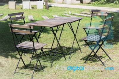 Outdoor Tables And Chairs Set Up On The Green Lawn Stock Photo