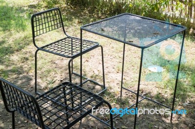 Outdoor Tables And Chairs Set Up On The Green Lawn Stock Photo