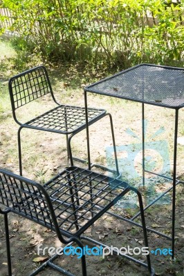 Outdoor Tables And Chairs Set Up On The Green Lawn Stock Photo