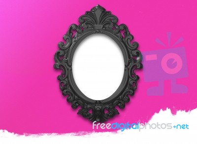 Oval Black Picture Frame With A Decorative On Pink Wall Stock Image