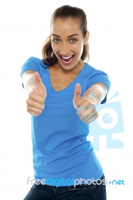 Overjoyed Woman Showing Double Thumbs Up Stock Photo