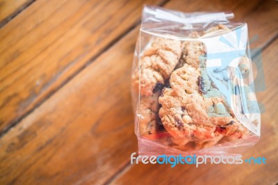 Pack Of Cereal Cookies On Wooden Table Stock Photo