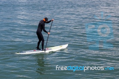 Paddling Surf Board Out Of Sausalito Marina Stock Photo