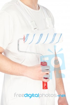 Paint Roller In Hand Of A Worker Stock Photo