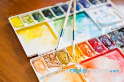 Paintbrush And Paint Palette Stock Photo