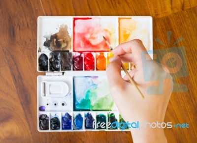 Paintbrush And Paint Palette Stock Photo