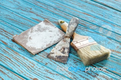 Paintbrush  Trowel Sandpaper  Still Life Wood Teak Table Antique… Stock Photo