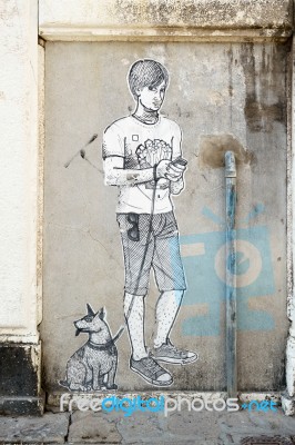 Painting Of Boy And Dog On A Wall In Venice Stock Photo