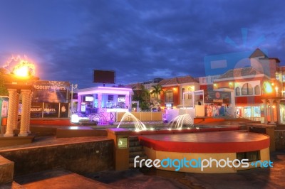 Palm Beach Is A Street Containing Hotels And Restaurants In The Twilight In Aruba Stock Photo