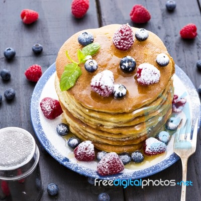 Pancakes With Honey And Berries Stock Photo