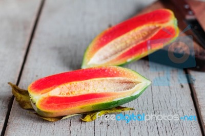 Papaya Cut On The Old Wooden Stock Photo