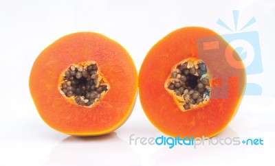 Papaya Fruit Sliced On Half Stock Photo