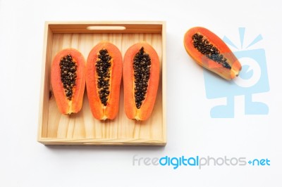 Papaya In Wooden Box On White Background Stock Photo