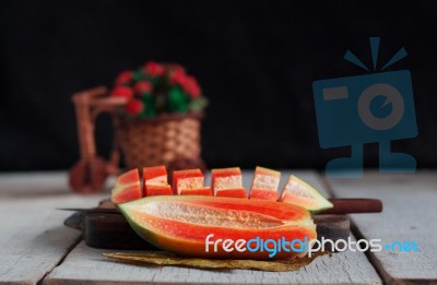 Papaya Of Cut On Wooden Stock Photo