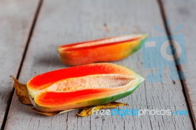 Papaya Of Half On Wooden Stock Photo