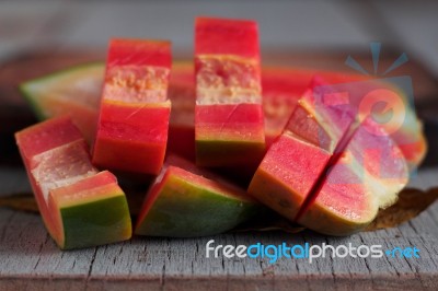 Papaya Of Slices On Wooden Stock Photo