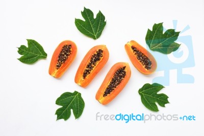 Papaya With Leaf On White Background Stock Photo