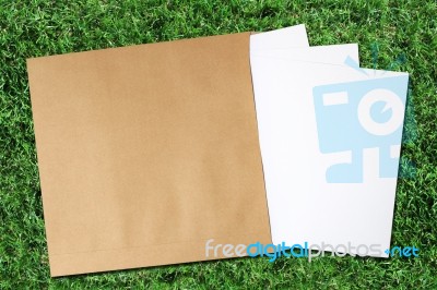 Paper And Envelope On Grass Stock Photo