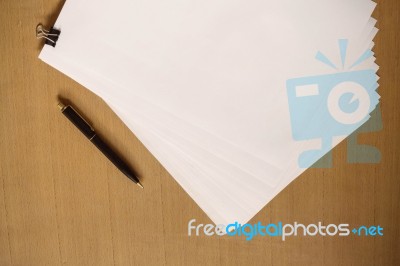 Paper And Pen On Wooden Stock Photo