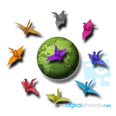 Paper Bird Around Earth Stock Photo