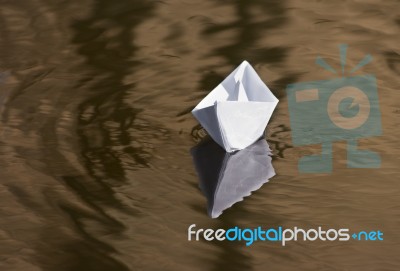 Paper Boat Floating In The Creek Stock Photo