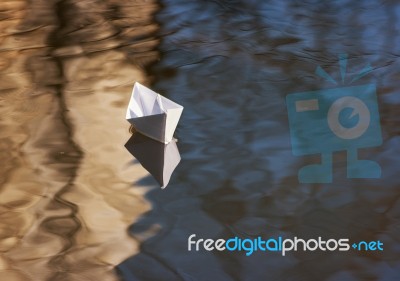 Paper Boat Floating In The Creek Stock Photo