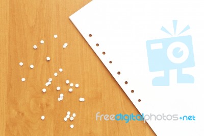 Paper List With Holes And Confetti Stock Photo