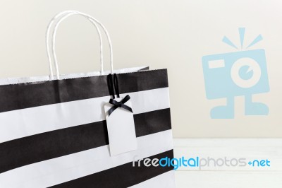 Paper Shopping Bag With Gift Tag Stock Photo