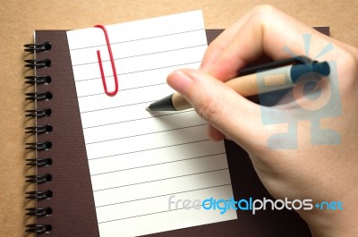 Paper With Hand Holding Pen Stock Photo