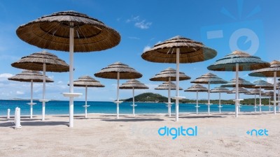 Parasols At Liscia Ruja Beach In Sardinia Stock Photo