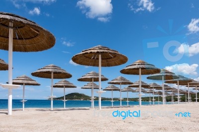 Parasols At Liscia Ruja Beach In Sardinia Stock Photo