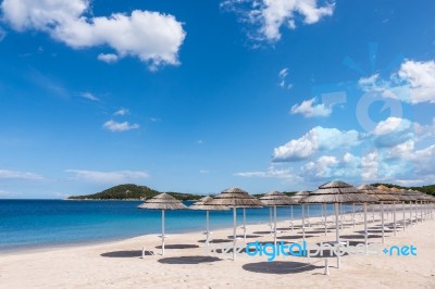 Parasols At Liscia Ruja Beach In Sardinia Stock Photo