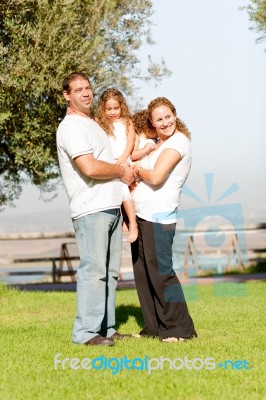 Parents Carrying Their Kids Stock Photo